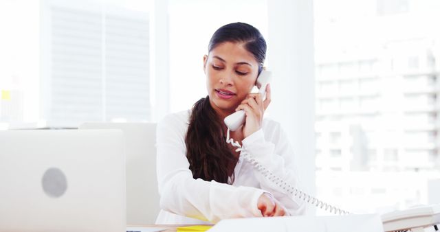 Businesswoman on Phone Call Working in Modern Office - Download Free Stock Images Pikwizard.com