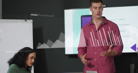 Man Analyzing Statistical Data in Modern Office