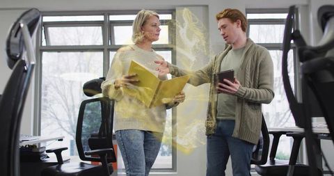 Innovative Coworkers Collaborating with Digital Technology in Modern Office