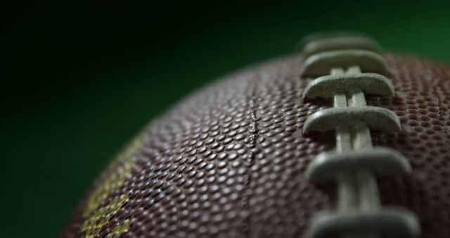 Close-up of a Football on Green Background - Download Free Stock Images Pikwizard.com