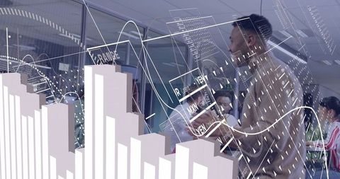 Presenting data overlays and analytics charts to team in glass boardroom