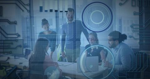 Business team collaborating over laptop with futuristic hud interface for strategy