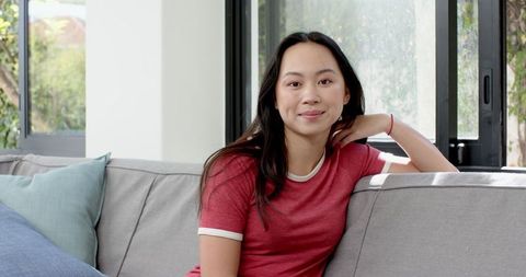 Relaxed Woman in Modern Home Enjoying Tranquility