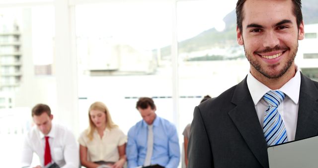 Confident Businessman at Interview, Candidates Waiting in Background - Download Free Stock Images Pikwizard.com