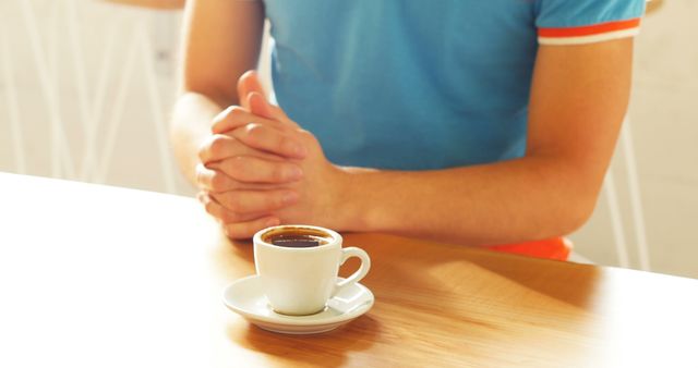 Man's Hands Resting on Table Near Espresso Cup - Download Free Stock Images Pikwizard.com