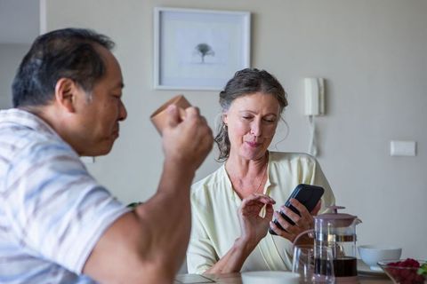 Relaxed morning coffee ritual with digital touch