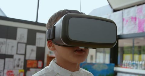 Young Boy Exploring Education with VR Headset in Classroom - Download Free Stock Images Pikwizard.com