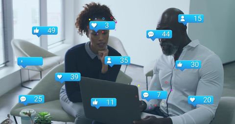 Business Colleagues Engaging with Social Media Analytics at Office