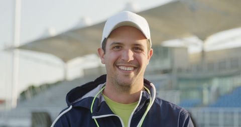 Smiling Male Coach at Outdoor Hockey Court - Download Free Stock Images Pikwizard.com