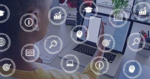 Man Using Laptop and Smartphone with Infographic Icons