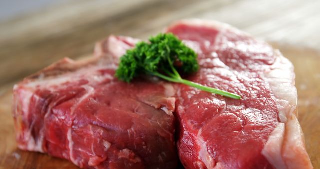 Close-Up of Fresh Raw Beef Steak with Parsley - Download Free Stock Images Pikwizard.com