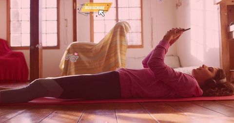 Young Woman Engaging in Digital Fitness at Home