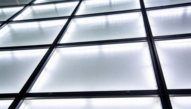 Frosted led panel grid showing black mullions and diffused light in diagonal pattern