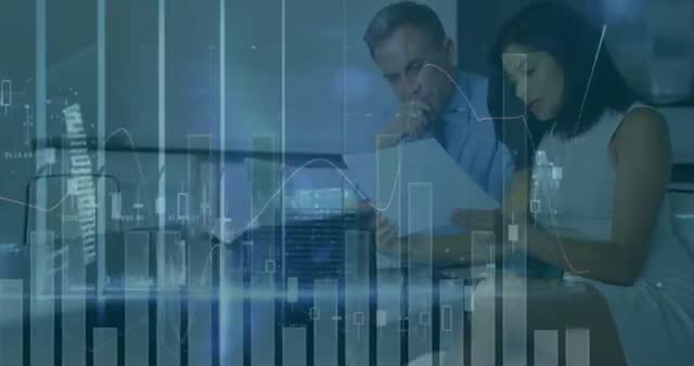 Man and woman examining documents associated with stock market graphs displayed in background convey financial business environment. Useful for depicting subjects related to corporate finance, investments, stock trading strategies, and general economic analysis.