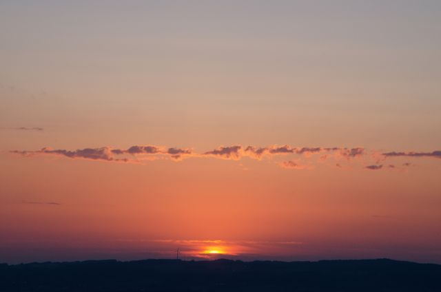 Tranquil Sunset with Vibrant Colors and Distant Hills - Download Free Stock Photos Pikwizard.com