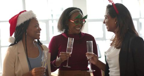 Office Holiday Party: Diverse Women Toasting with Champagne and Festive Accessories