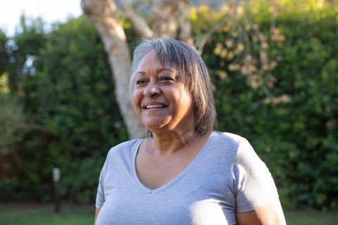 Joyful Senior African American Woman Enjoying Backyard