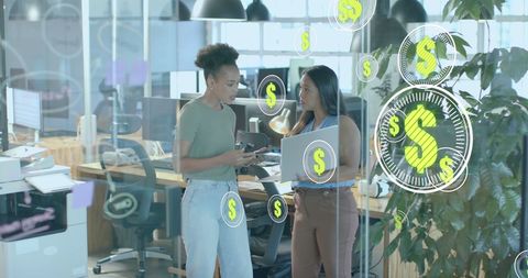 Businesswomen Discuss Global Finance with Digital Interface in Modern Office