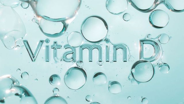 Vitamin d glass lettering refracting in aqua liquid with floating bubbles and droplets