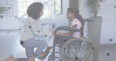 Mother Comforting Child in Wheelchair with Digital Network Overlay - Download Free Stock Images Pikwizard.com