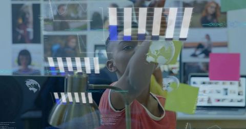 Boy placing sticky notes on glass brainstorming with augmented hud in classroom