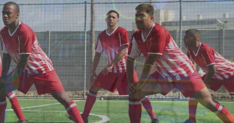 Footballers Stretching with Digital Interface Overlay on Sports Field