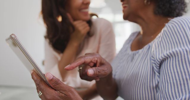 Elderly Woman Learning to Use Tablet with Young Woman - Download Free Stock Images Pikwizard.com