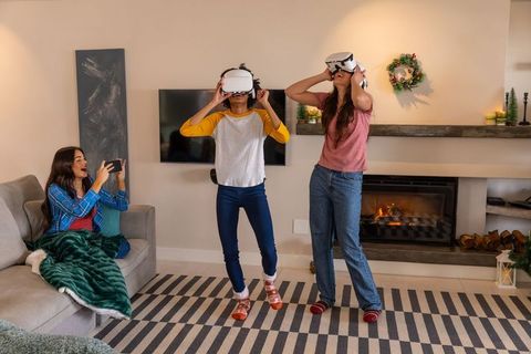 Friends enjoying virtual reality adventures in living room