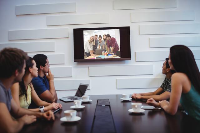 Business executives doing a video conference in the conference room