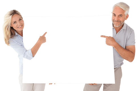 Happy couple holding transparent poster board while smiling