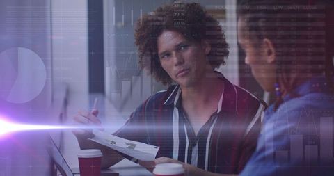 Diverse Colleagues Engaging with Digital Analytics in Modern Office