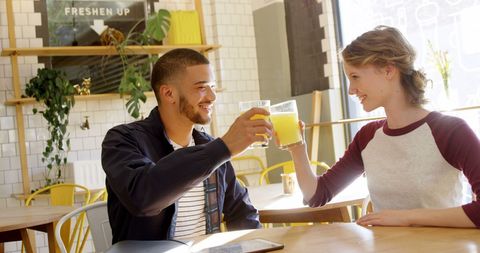 Cheerful Friends Toasting at a Bright Cafe
