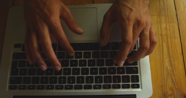 Person Typing on Laptop with Wooden Table Background - Download Free Stock Images Pikwizard.com