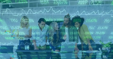 Diverse business team collaborating with stock market analytics