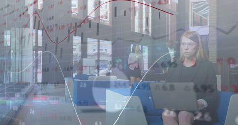 Businesswoman Analyzing Financial Data in Modern Office Lobby