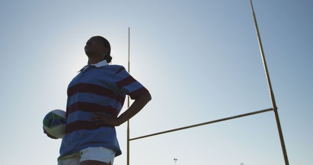 Female Rugby Player Holding Ball at Goal Posts in Training - Download Free Stock Images Pikwizard.com