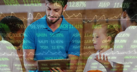 Business Professionals Analyzing Digital Stock Data on Device