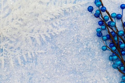 Winter Holiday Background with Snowflakes and Blue Decorative Berries