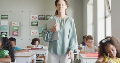 Engaged Classroom with Diverse Pupils and Proud Teacher - Download Free Stock Images Pikwizard.com
