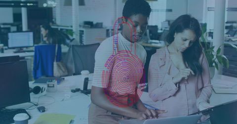 Diverse Professionals Collaborate on Digital Project in Modern Office