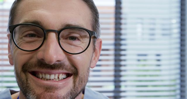 Happy Male Healthcare Professional Wearing Glasses Smiling at Camera - Download Free Stock Images Pikwizard.com