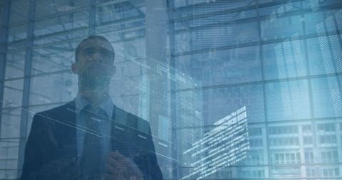 Businessman Analyzing Virtual Data Interface in Modern Office