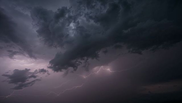 Dramatic lightning illuminates stormy night sky