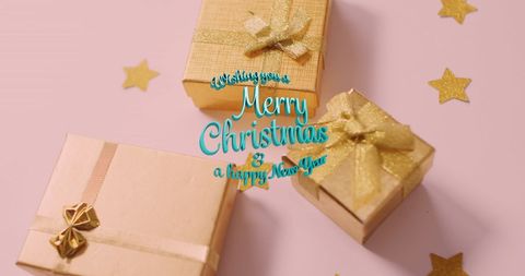 Golden Christmas Presents with Star Accents for Festive Holiday Celebrations - Download Free Stock Images Pikwizard.com