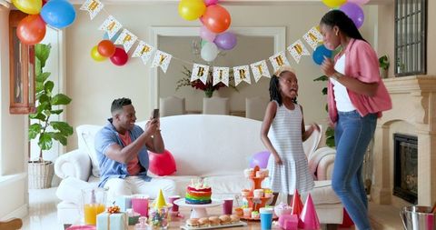 Family Birthday Celebration with Joyful Dance in Living Room