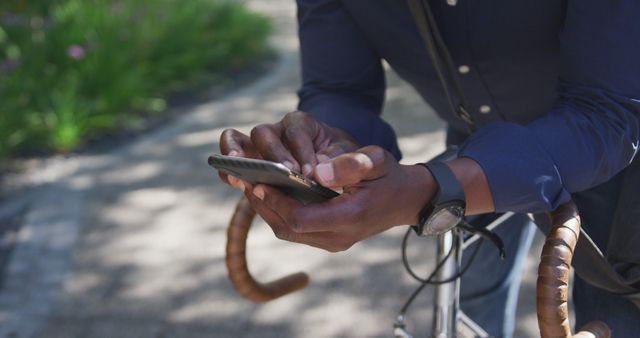 Man Texting while Leaning on Bicycle Outdoors - Download Free Stock Images Pikwizard.com