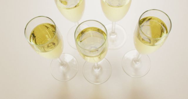 Image of champagne in glasses on beige background - Download Free Stock Photos Pikwizard.com