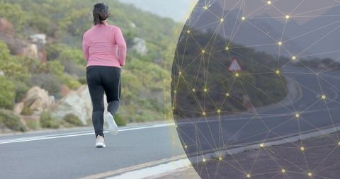 Woman jogging on mountain road with digital mesh overlay
