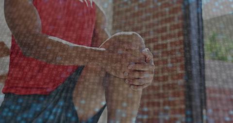 Athlete Stretching in Urban Gym Primes Body for Workout