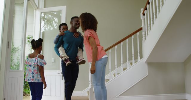 Happy African American Family Greeting in Home Entrance - Download Free Stock Images Pikwizard.com